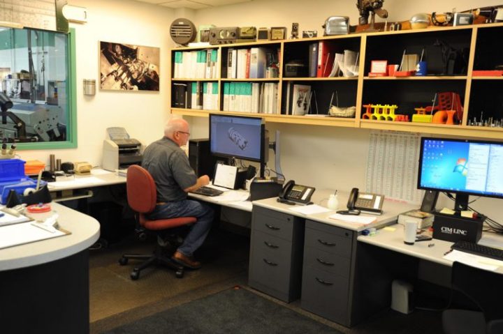 Engineer programming CNC Swiss lathe – design to production workflow